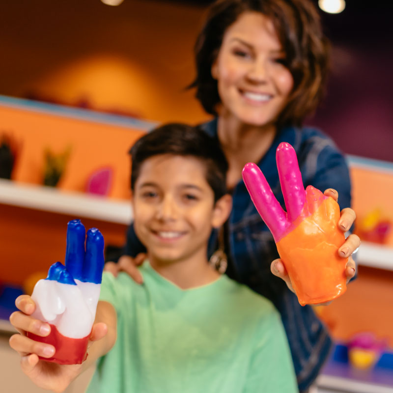 Mom and Son With Wax Hands