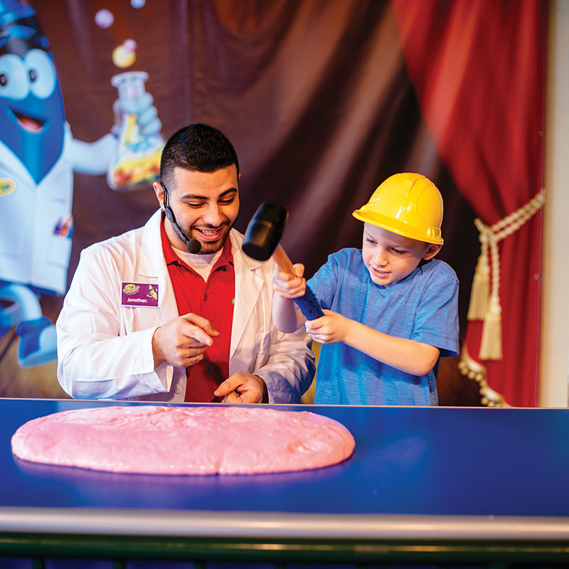 Child and presenter at Crayola Experience Cafe Show
