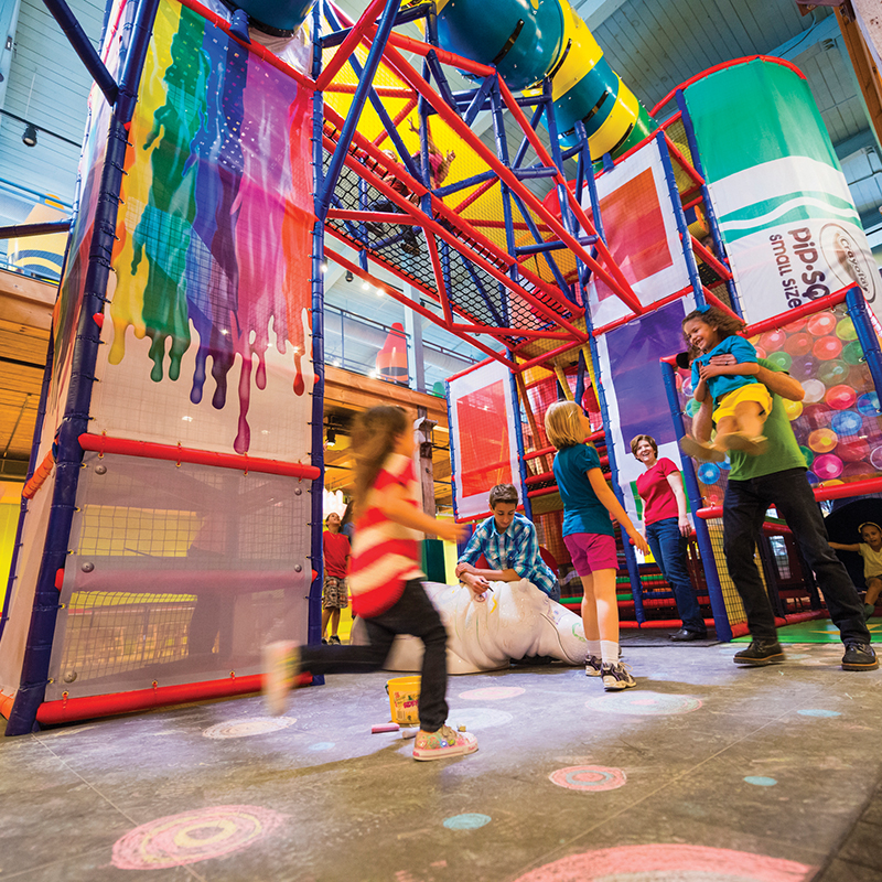 Kids playing at the playground at Crayola Experience