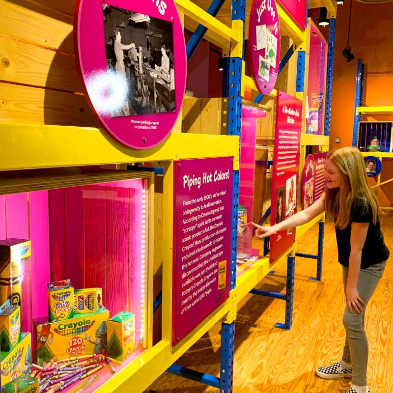 Girl looking at a window of product