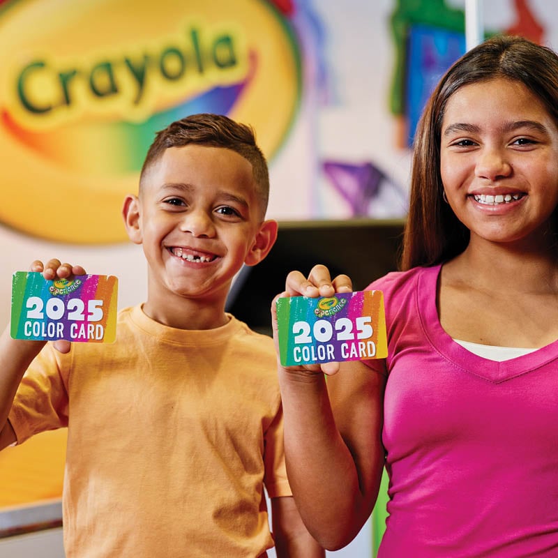 Two kids holding out "2025 Color Cards"