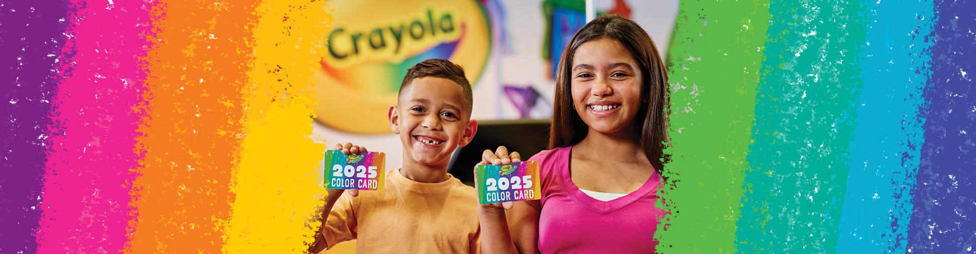 Two kids each holding out a "2025 Color Card"