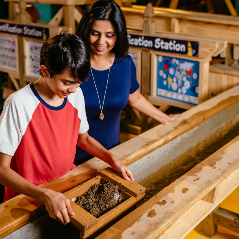 Mom and son at the gem mining activity