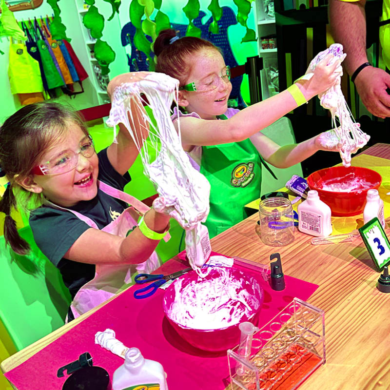 Two kids creating slime