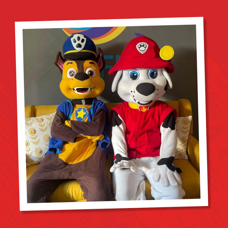 Two cartoon pup mascots