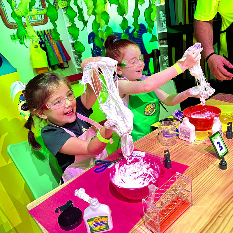 children creating slime in a laboratory