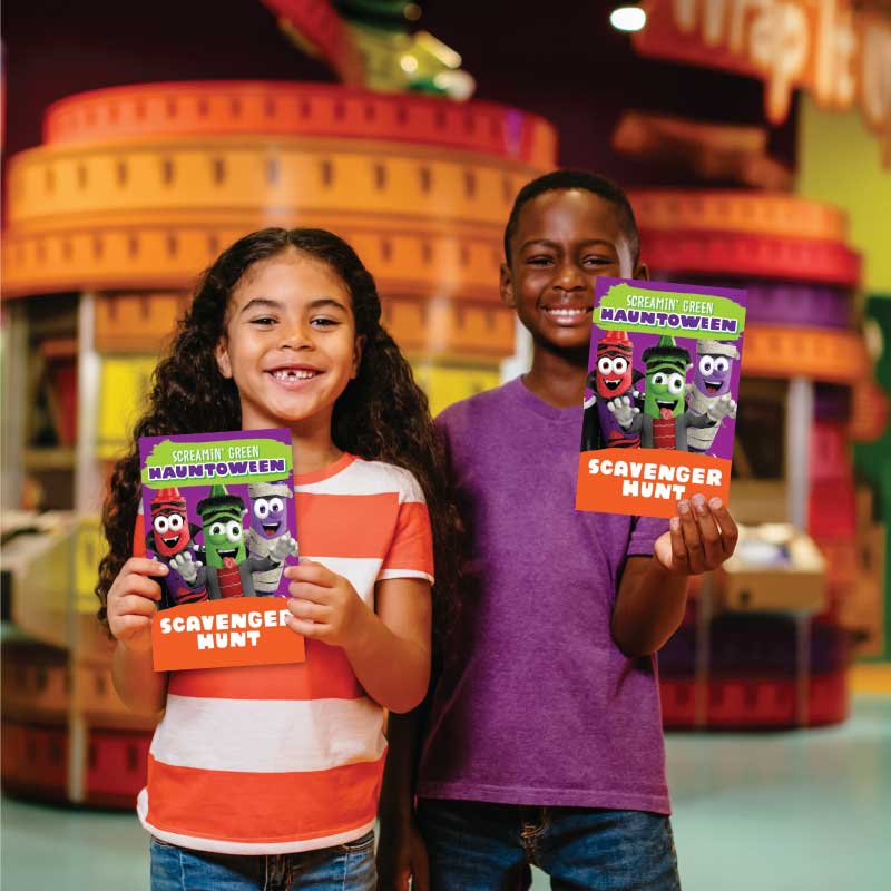 Two kids holding out scavenger hunts