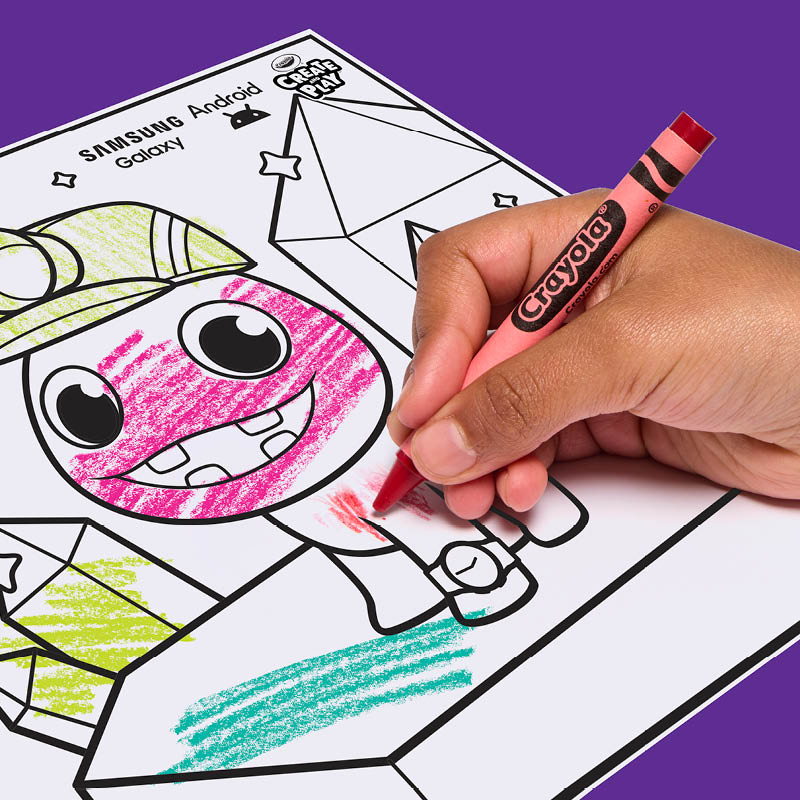 Child coloring a create and play character coloring page